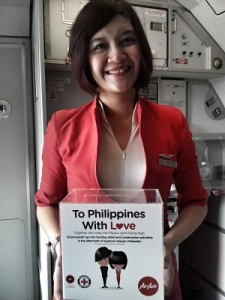 AirAsia flight attendant collects donations for Yolanda victims.